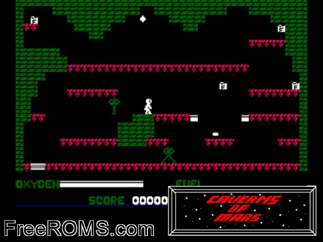 Caverns of Mars (UK) (1985) Amstrad CPC game showing 3D box cover and gameplay screenshot